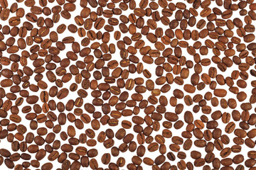 Spilled coffee beans on a light background.