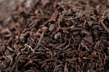 Earl Grey  black loose tea leaves background, shallow dof