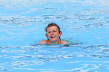 boy swimming in the pool