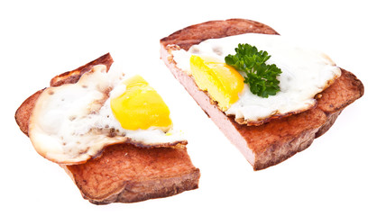 Halved meat loaf with fried egg