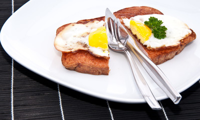 Halved meat loaf with fried egg