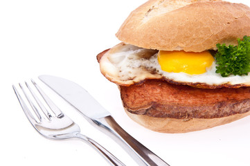 Meat loaf on a roll with fried egg