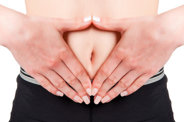 Woman with hands around belly button