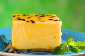 Fresh passion fruit cheesecake dessert with mint leaf
