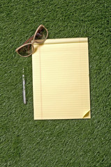 Naklejka premium Blank Paper On Grass