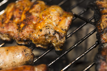 Closeup of fried meat on grill