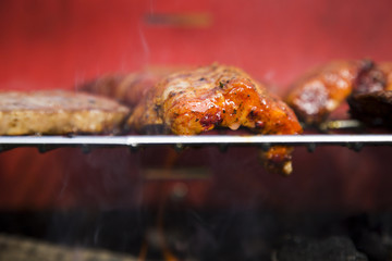 Closeup of fried burgers on grill