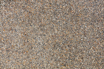 Lots of small pebbles on the wall.