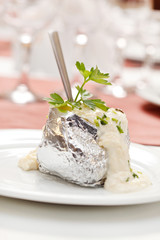 Baked potato with sour cream sauce