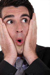Businessman faking surprise