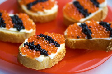 Caviar Snacks On A Red Plate