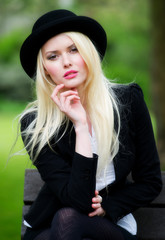 Cute young business woman in bowler hat