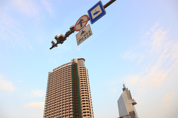 Traffic camera with telltale sign and prohibit sign under blue s