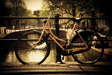 Amsterdam. Romantic canal bridge, bike