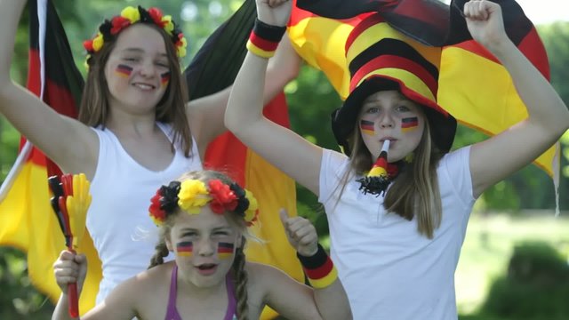 three girls cheering for the german team with sound