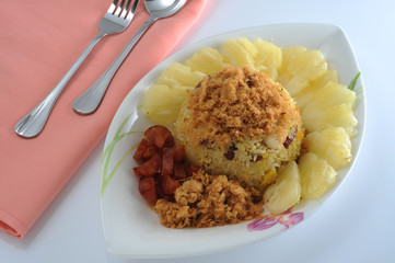 Fried rice with pineapple and shredded pork on top