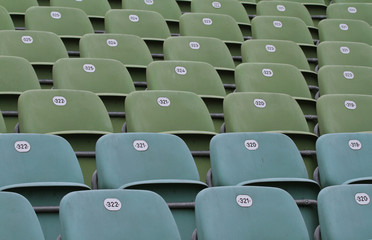 Rows of football stadium seats with numbers. © doncarlo