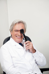 Optometrist With Ophthalmoscope