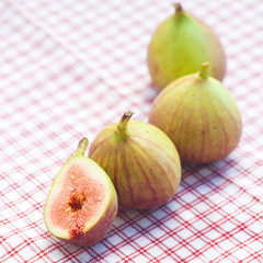 figs lying on plaid fabric