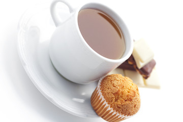 bar of chocolate,tea and muffin isolated on white