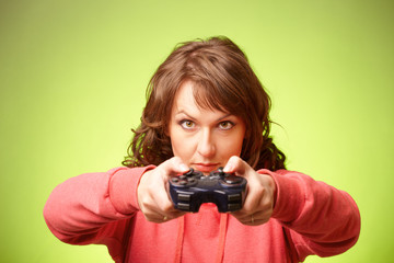 Beautiful womanl with gamepad playing vieogame © Monika Wisniewska