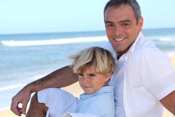 Fototapeta premium Father with his son at the beach