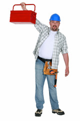 Man proudly displaying red metal tool box