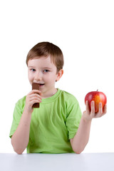 Smiling boy eating chocolate