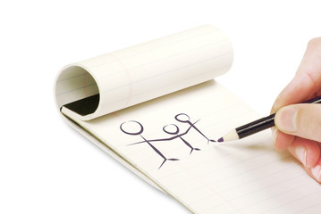 Pencil in hand writing on the notebook