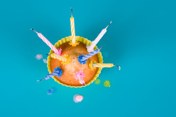 Festive cupcake with a blow out candles