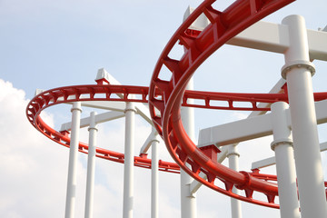 Curve of red and white roller coaster.