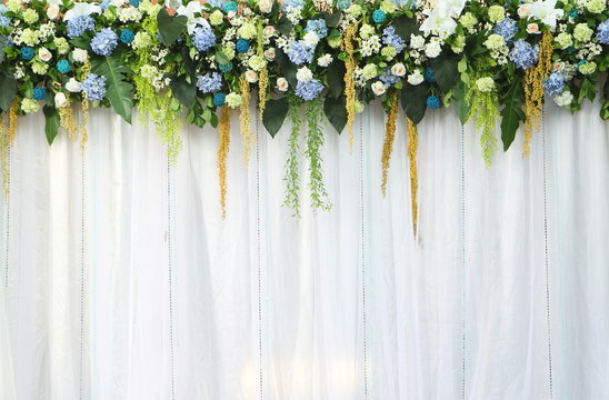 Beautiful backdrop flowers over white fabric.