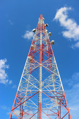 Communication tower over a blue sky.