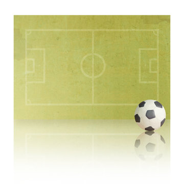 Plasticine Soccer football on paper field, white background