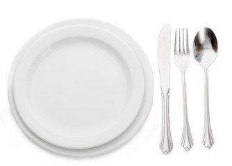 White empty plate with fork, spoon and knife isolated on white
