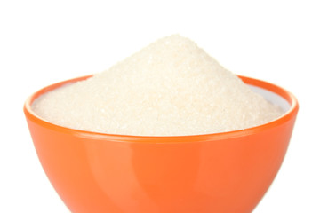 A colorful bowl full of white sugar on white background