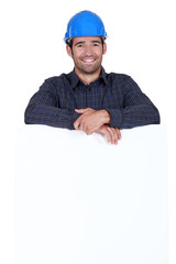 A portrait of a smiling construction worker.