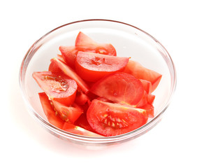 Diced tomatoes in glass bowl isolated on white
