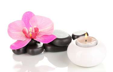 Fototapeta na wymiar Spa stones with orchid flower and candle isolated on white