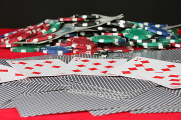 playing cards on a red poker table close-up