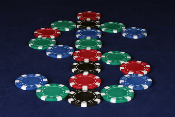 poker chips in the form of dollars on a blue table