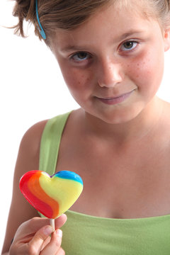 Little Girl Holding A Lolipop