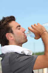 Man drinking bottle of water