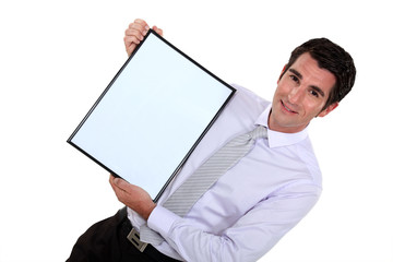 Businessman presenting blank advertising board
