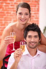 Elegant couple drinking champagne