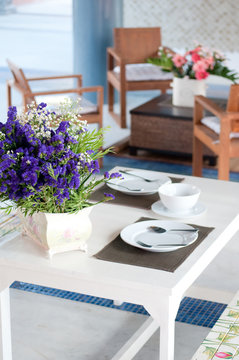 dining table set with dish and flower