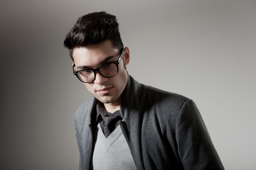 attractive man dressed casual wearing glasses - studio shot