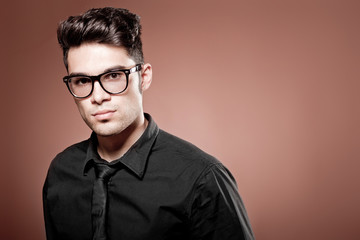 attractive man dressed casual wearing glasses - studio shot