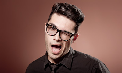 attractive man dressed casual wearing glasses - studio shot