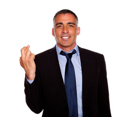 Adult latin man crossing the fingers